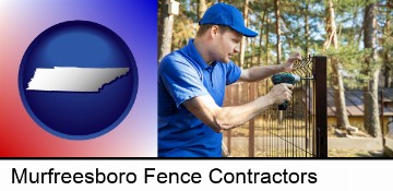 fence builder attaching fencing to a fence post in Murfreesboro, TN