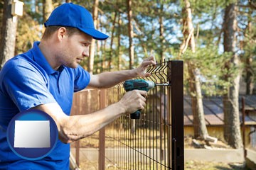 fence builder attaching fencing to a fence post - with Wyoming icon